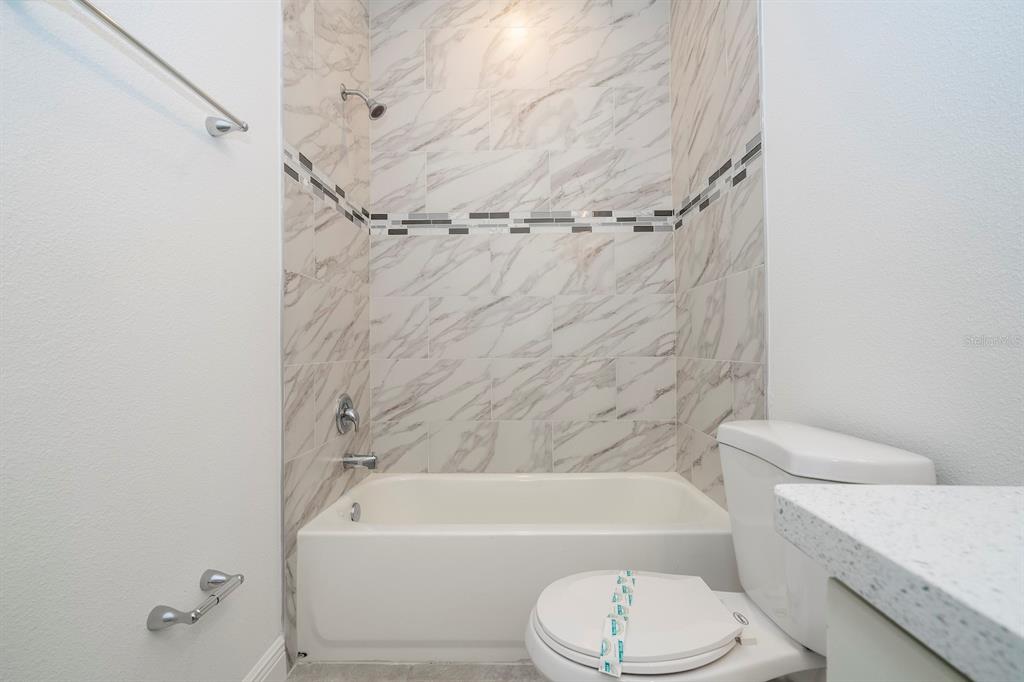 8 Locust Run Ocala, FL 34472 - Photo 52 of 71 a bathroom with a toilet and a bathtub