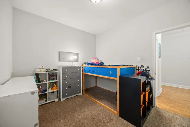 a room with furniture and white walls