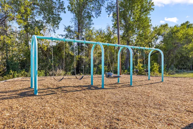 a view of a park with swings