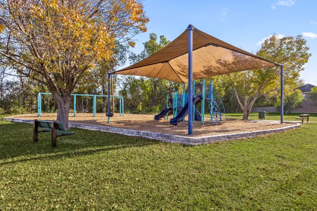 a view of a park with swings