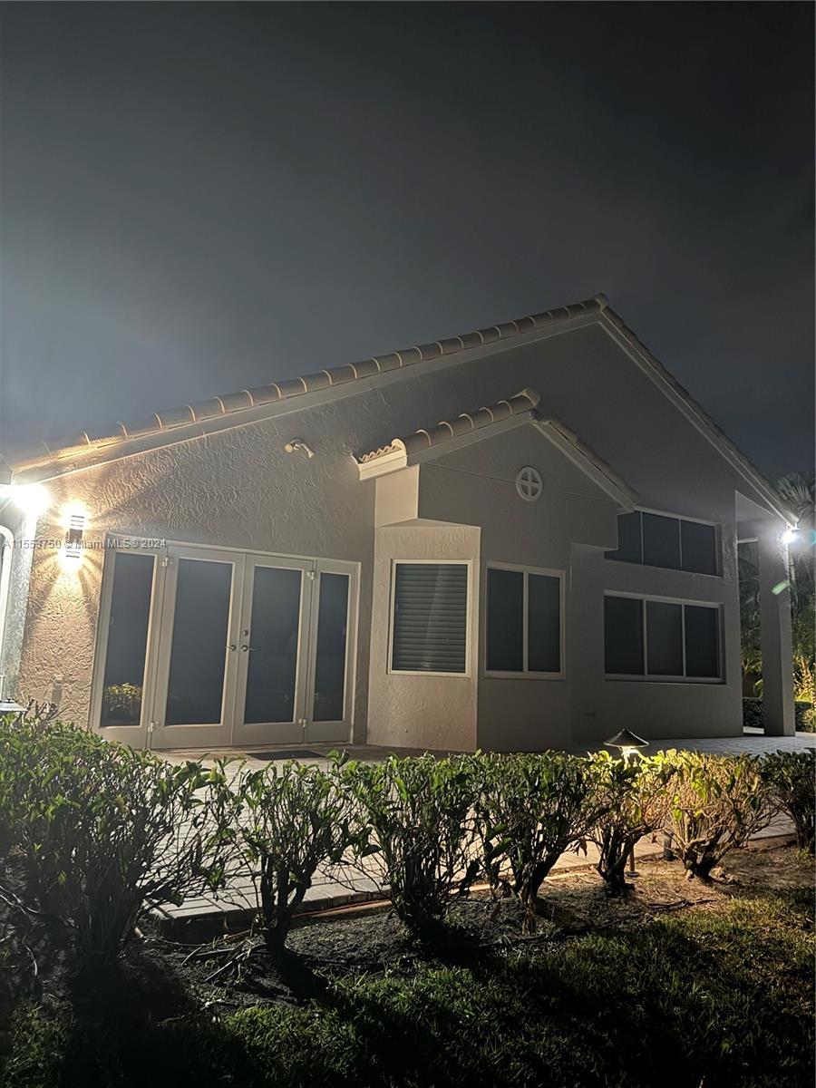 1400 Seabay Road, Unit 1400 Weston, FL 33326 - Photo 11 of 11 a front view of a house with a yard