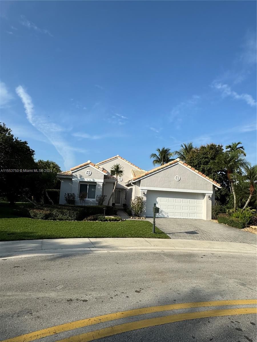 1400 Seabay Road, Unit 1400 Weston, FL 33326 - Photo 3 of 11 a front view of a house with a yard