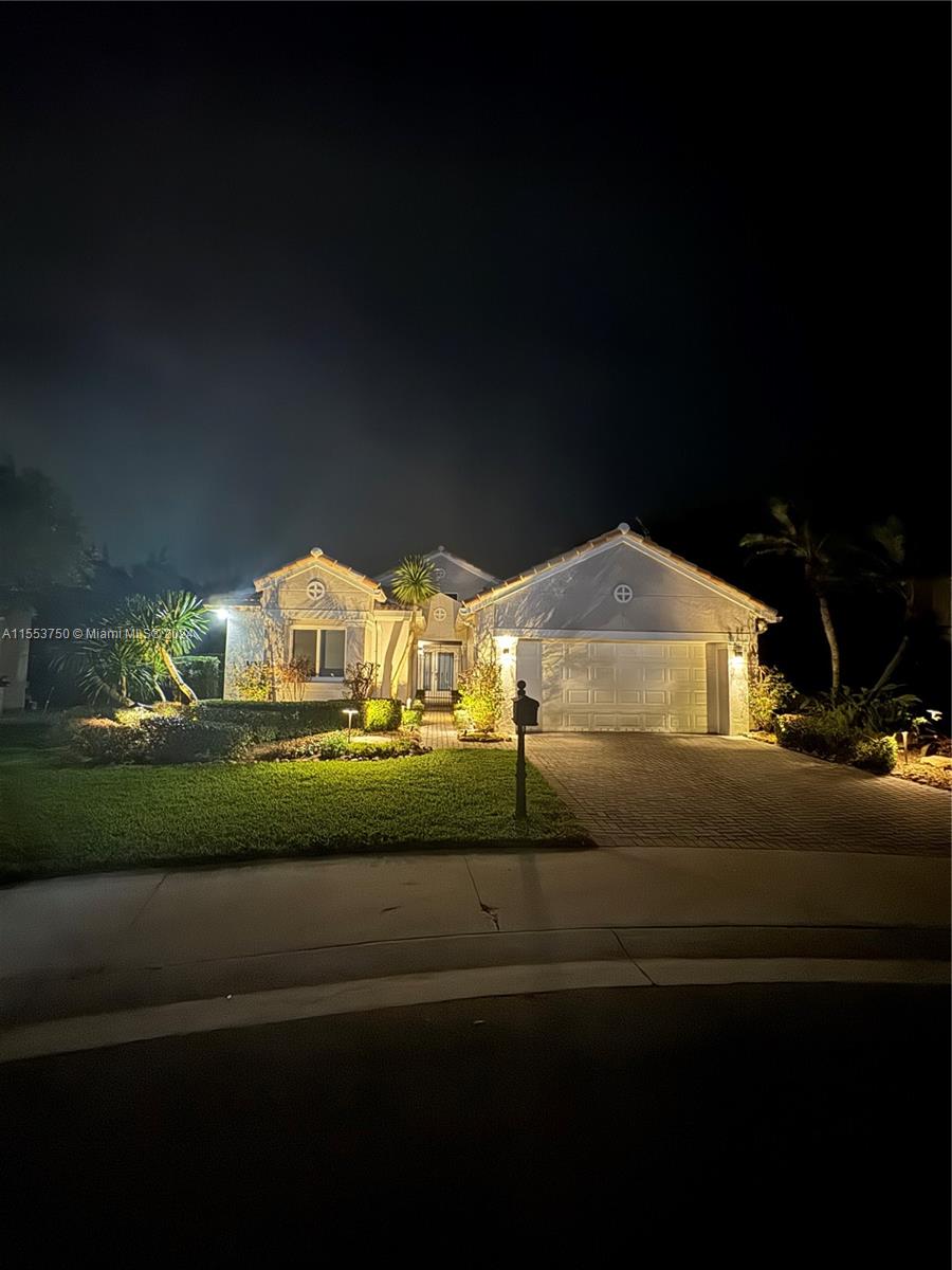 1400 Seabay Road, Unit 1400 Weston, FL 33326 - Photo 4 of 11 a view of a street with houses