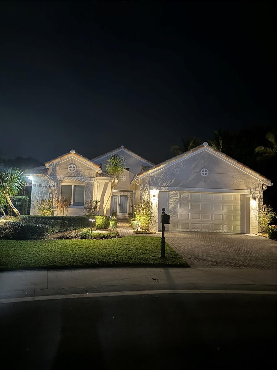1400 Seabay Road, Unit 1400 Weston, FL 33326 - Photo 5 of 11 a front view of a house with a garden