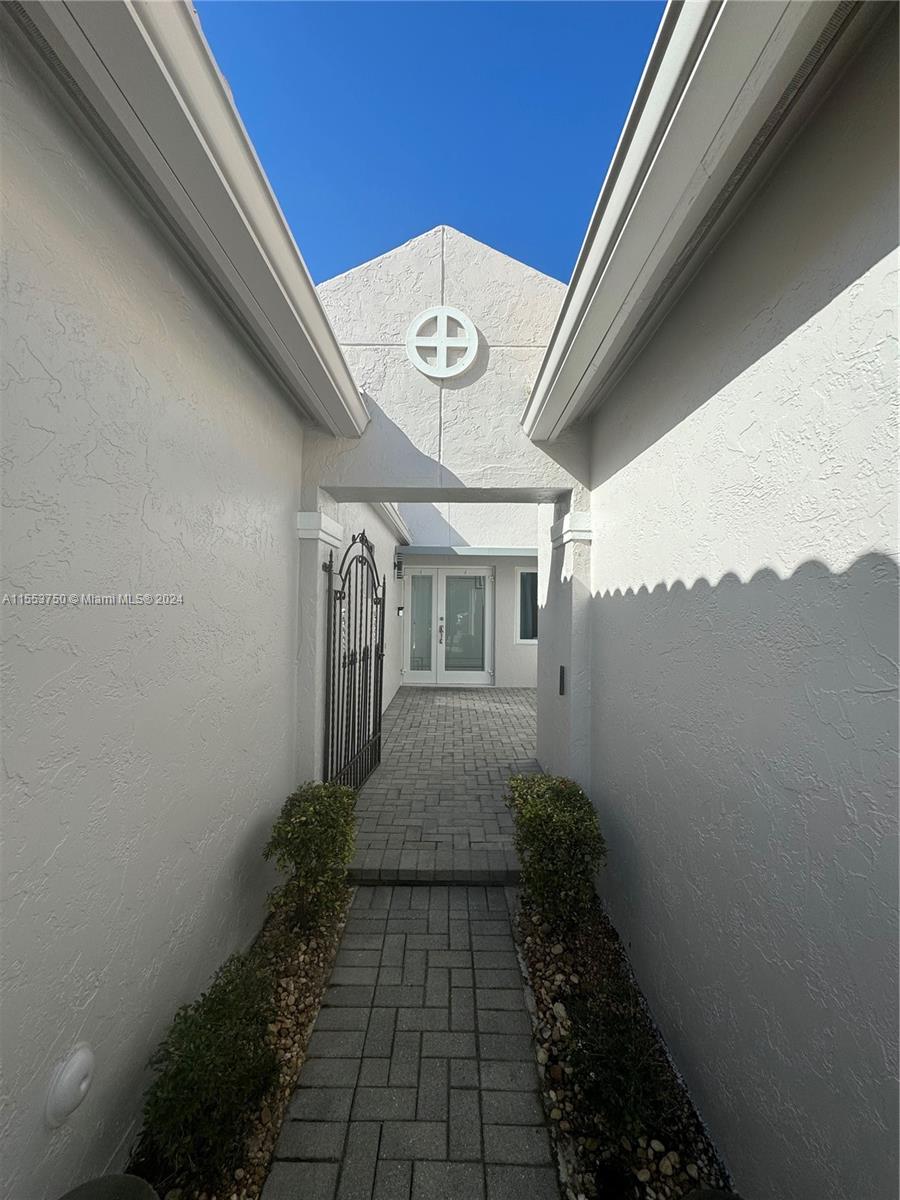 1400 Seabay Road, Unit 1400 Weston, FL 33326 - Photo 7 of 11 a view of a pathway of a building