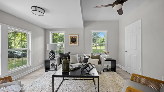 a living room with furniture and windows