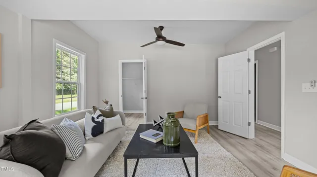 a living room with furniture and a window