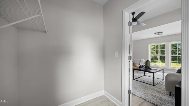 a view of a livingroom with furniture and wooden floor