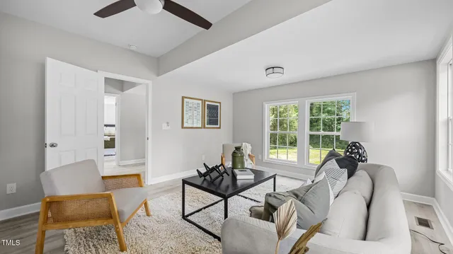 a living room with furniture and a window