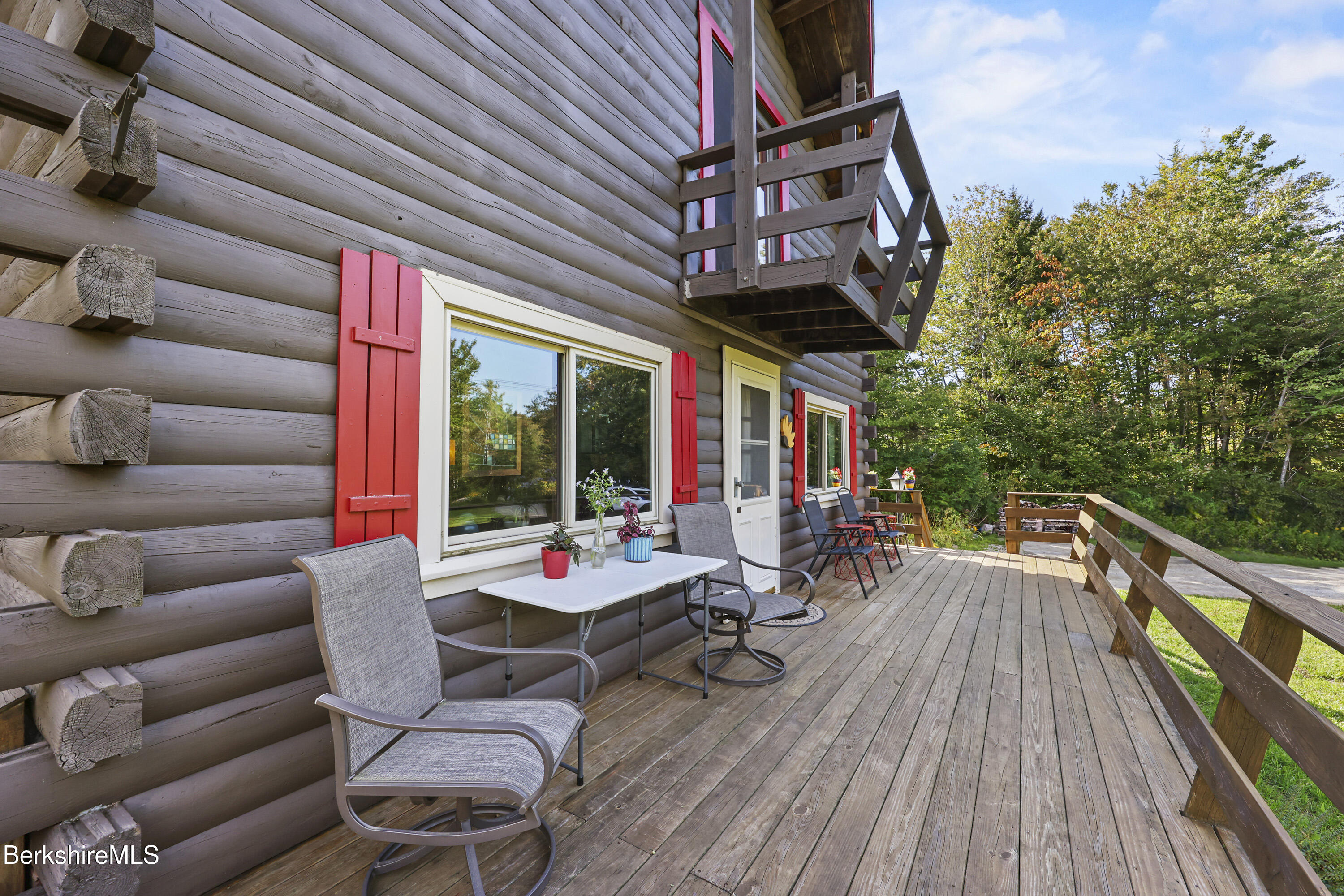 78 East Main Road Peru, MA 01235 - Photo 6 of 56 a view of a patio with couches chairs and wooden floor