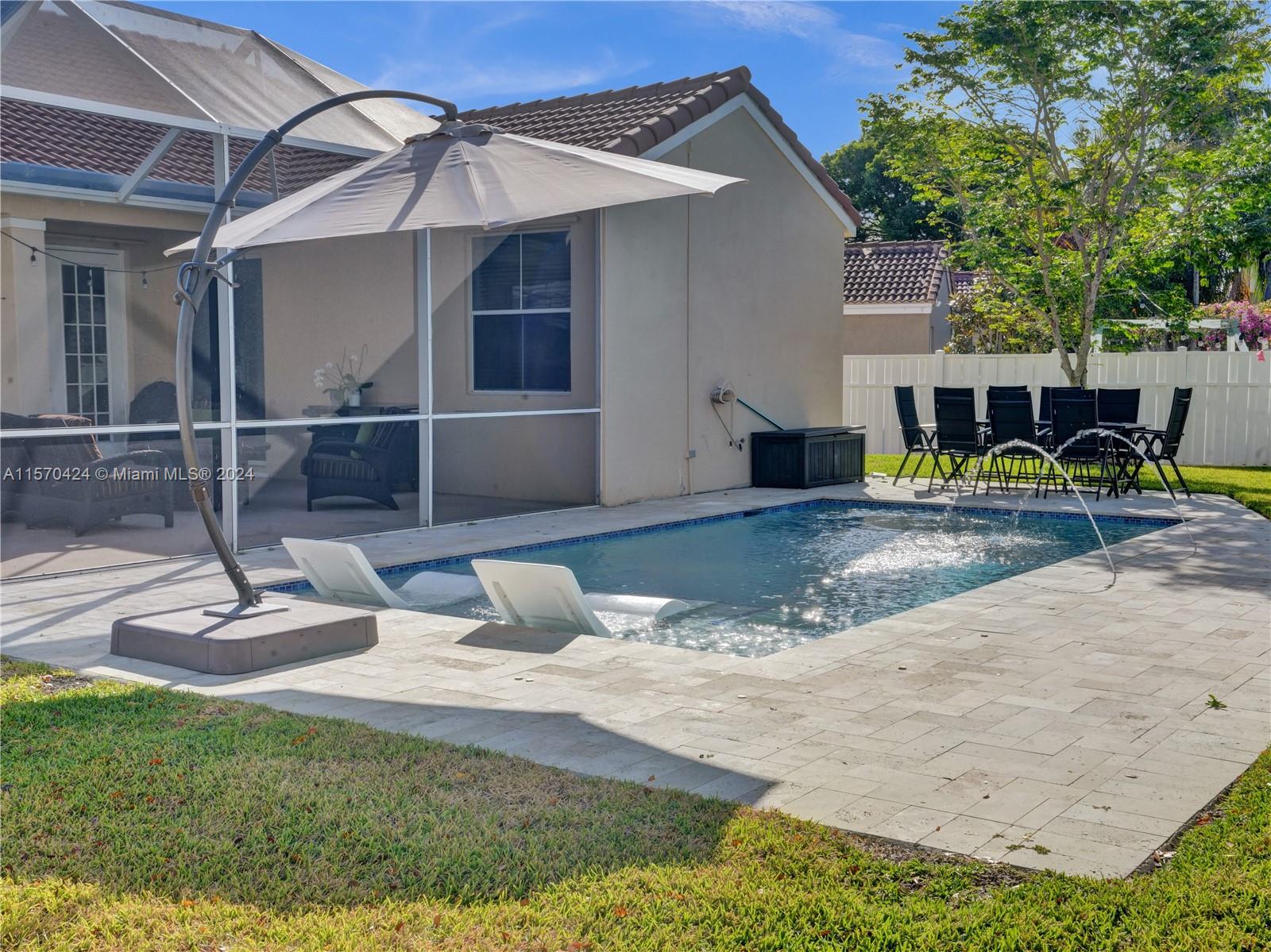 849 Falling Water Road Weston, FL 33326 - Photo 19 of 25 a view of a house with backyard