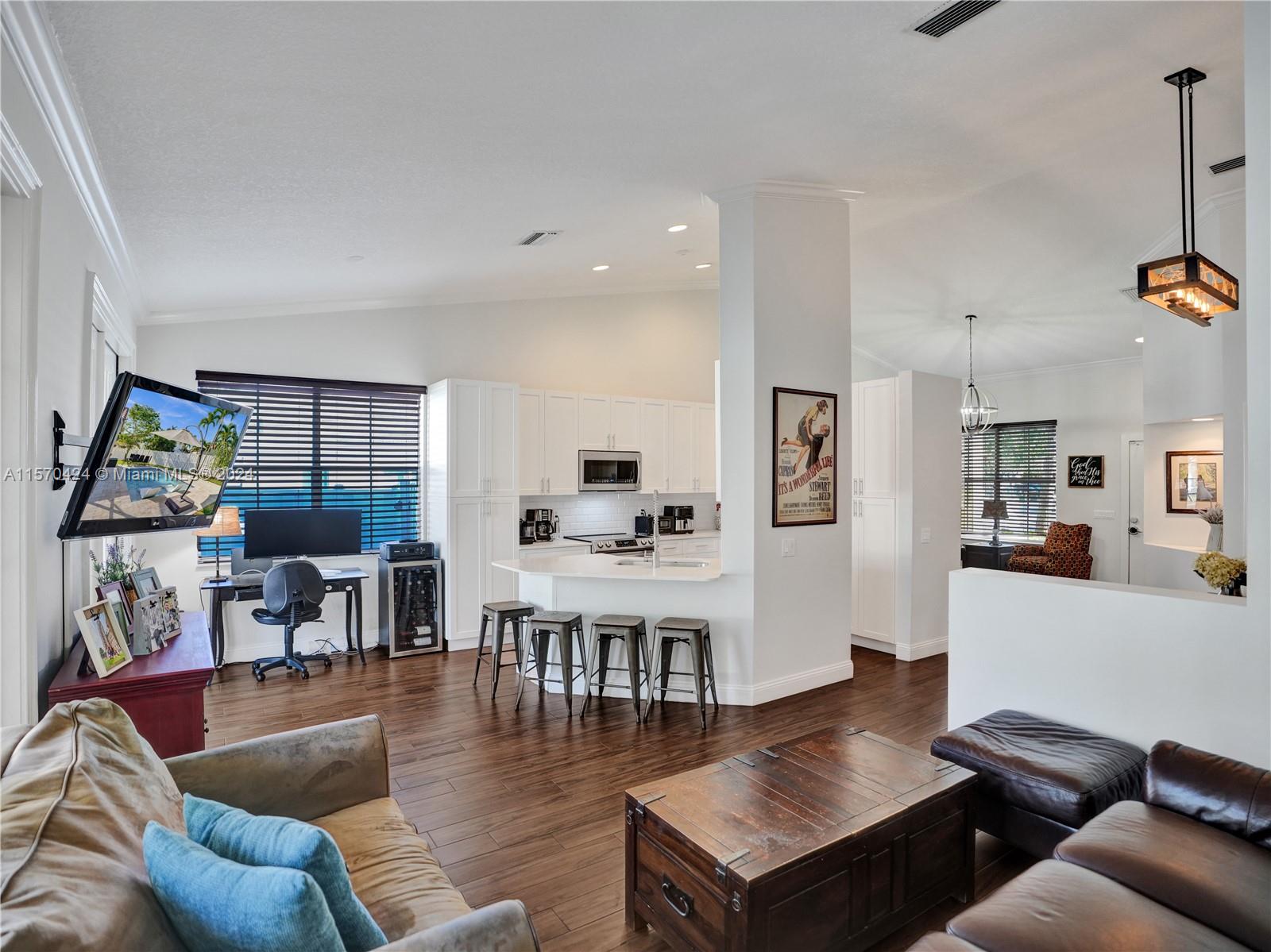 849 Falling Water Road Weston, FL 33326 - Photo 8 of 25 a living room with furniture and wooden floor