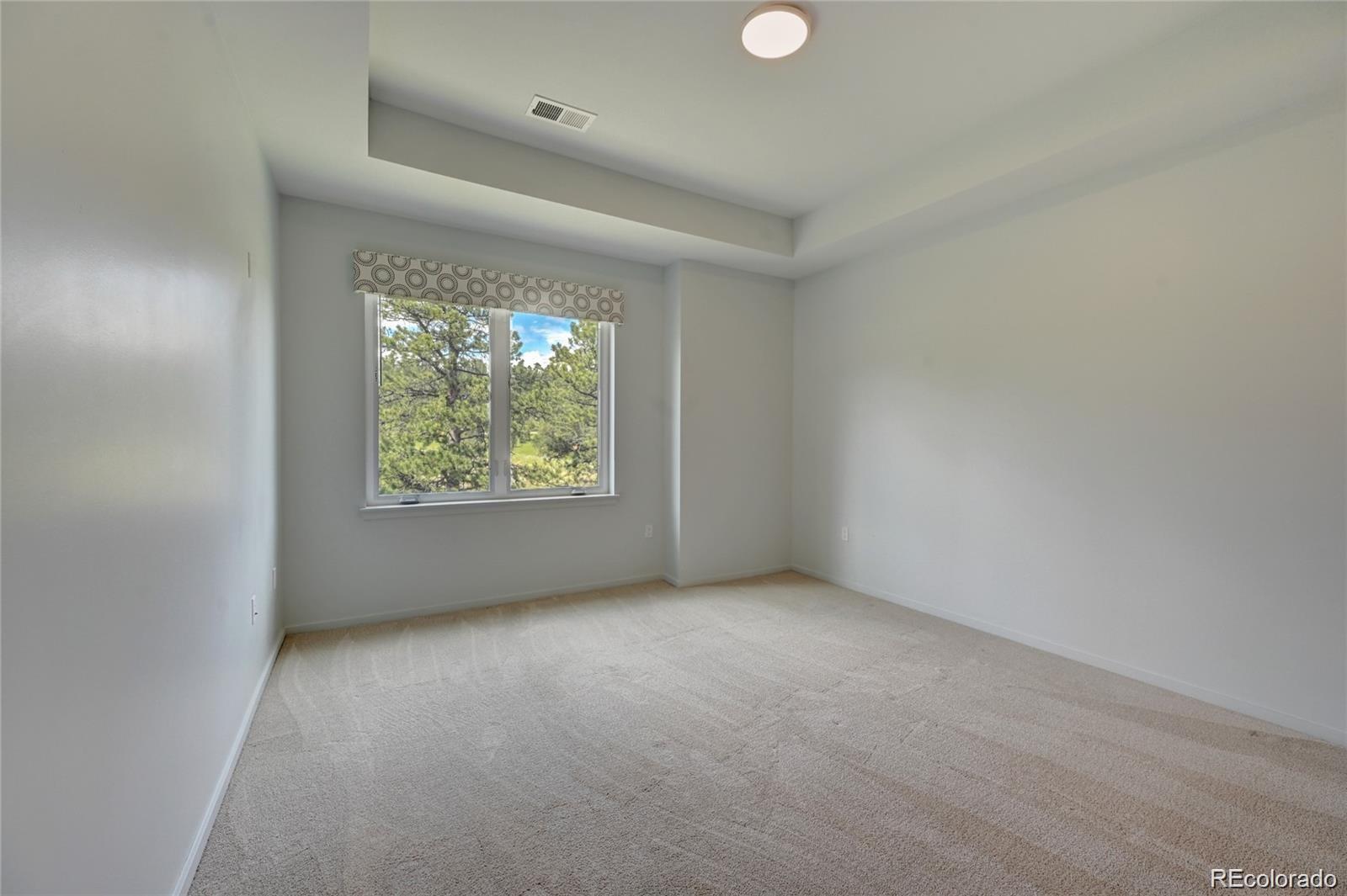 31191 Black Eagle Drive, Unit 301 Evergreen, CO 80439 - Photo 15 of 35 an empty room with windows