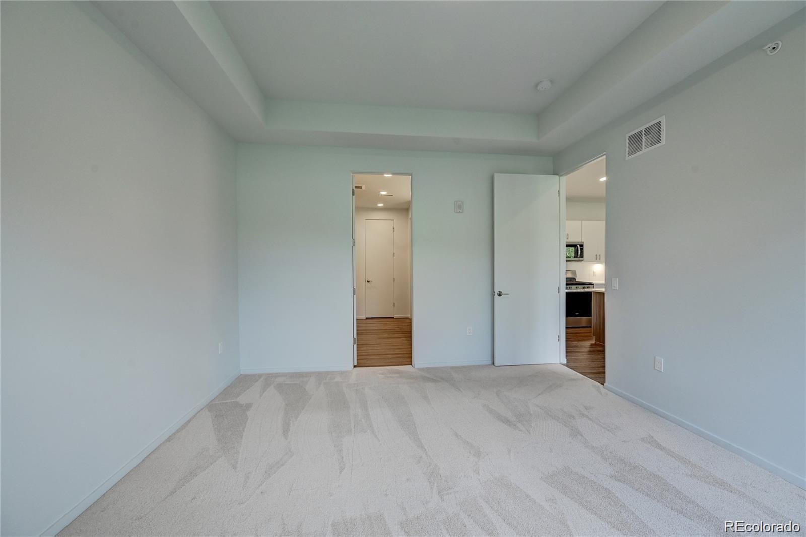 31191 Black Eagle Drive, Unit 301 Evergreen, CO 80439 - Photo 16 of 35 a view of empty room with wooden floor