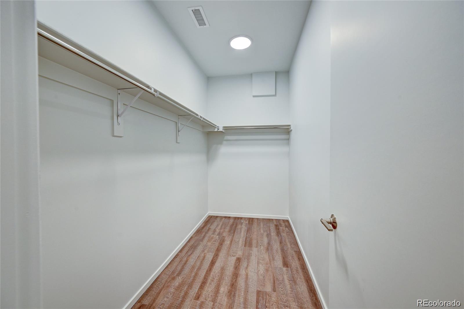 31191 Black Eagle Drive, Unit 301 Evergreen, CO 80439 - Photo 19 of 35 a view of a room with wooden floor