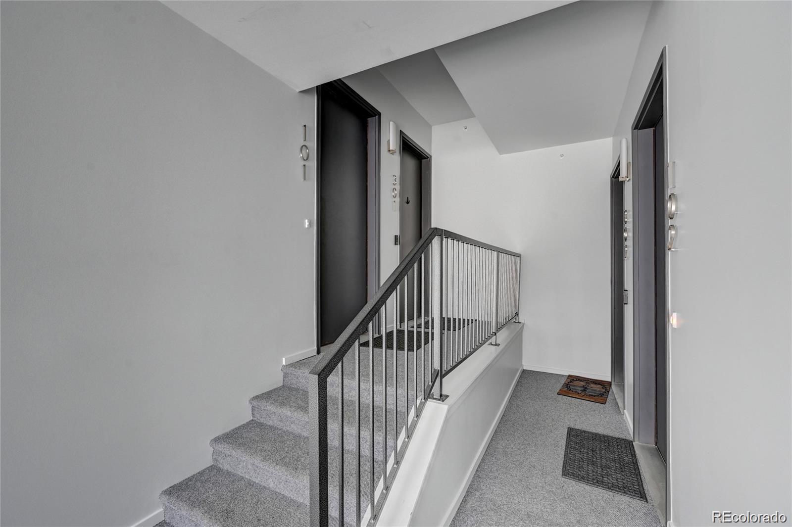31191 Black Eagle Drive, Unit 301 Evergreen, CO 80439 - Photo 2 of 35 a view of a hallway with staircase