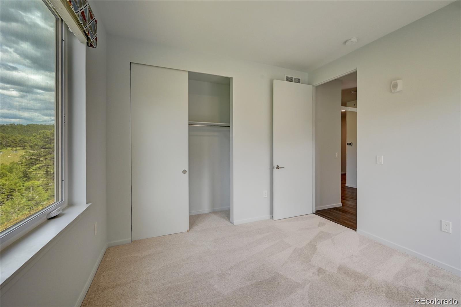 31191 Black Eagle Drive, Unit 301 Evergreen, CO 80439 - Photo 21 of 35 a view of an empty room with a window
