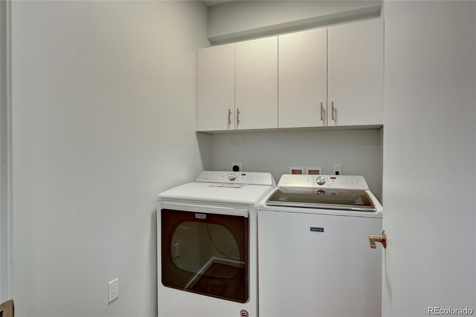 31191 Black Eagle Drive, Unit 301 Evergreen, CO 80439 - Photo 26 of 35 a utility room with dryer and washer