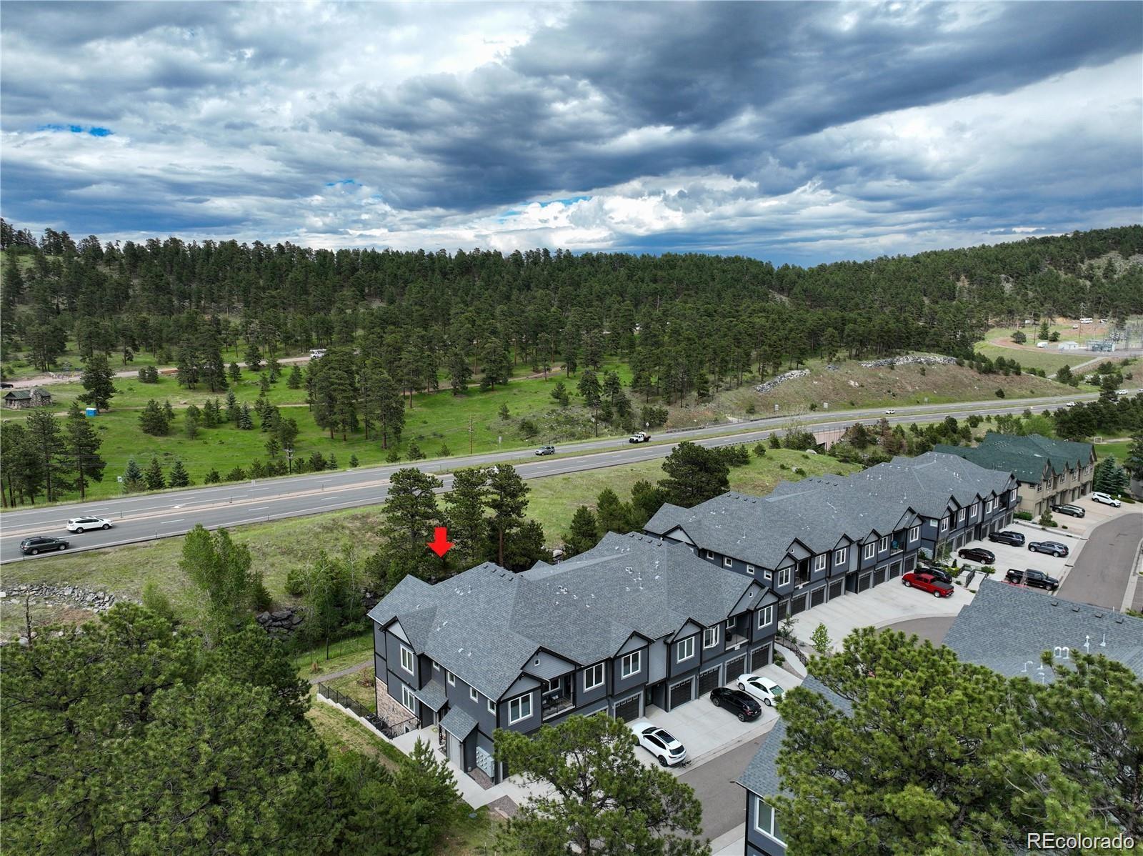 31191 Black Eagle Drive, Unit 301 Evergreen, CO 80439 - Photo 29 of 35 an aerial view of a houses with outdoor space and street view
