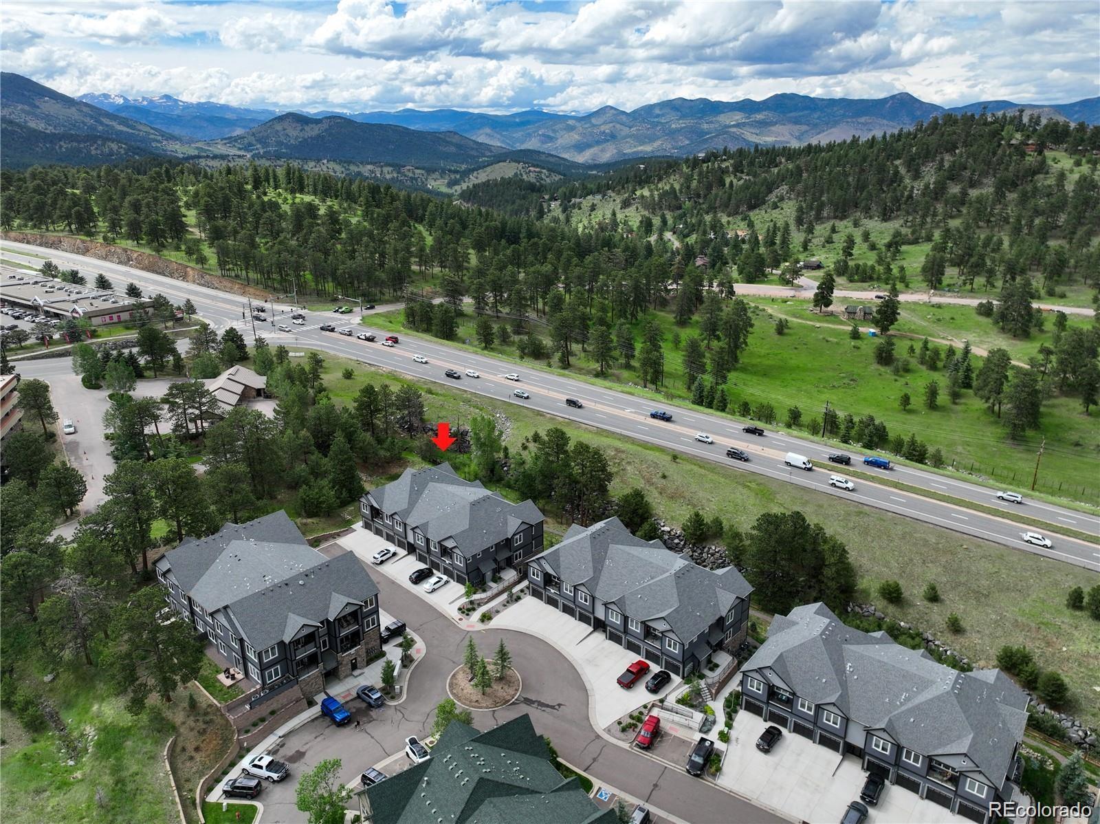 31191 Black Eagle Drive, Unit 301 Evergreen, CO 80439 - Photo 30 of 35 an aerial view of a house with a garden