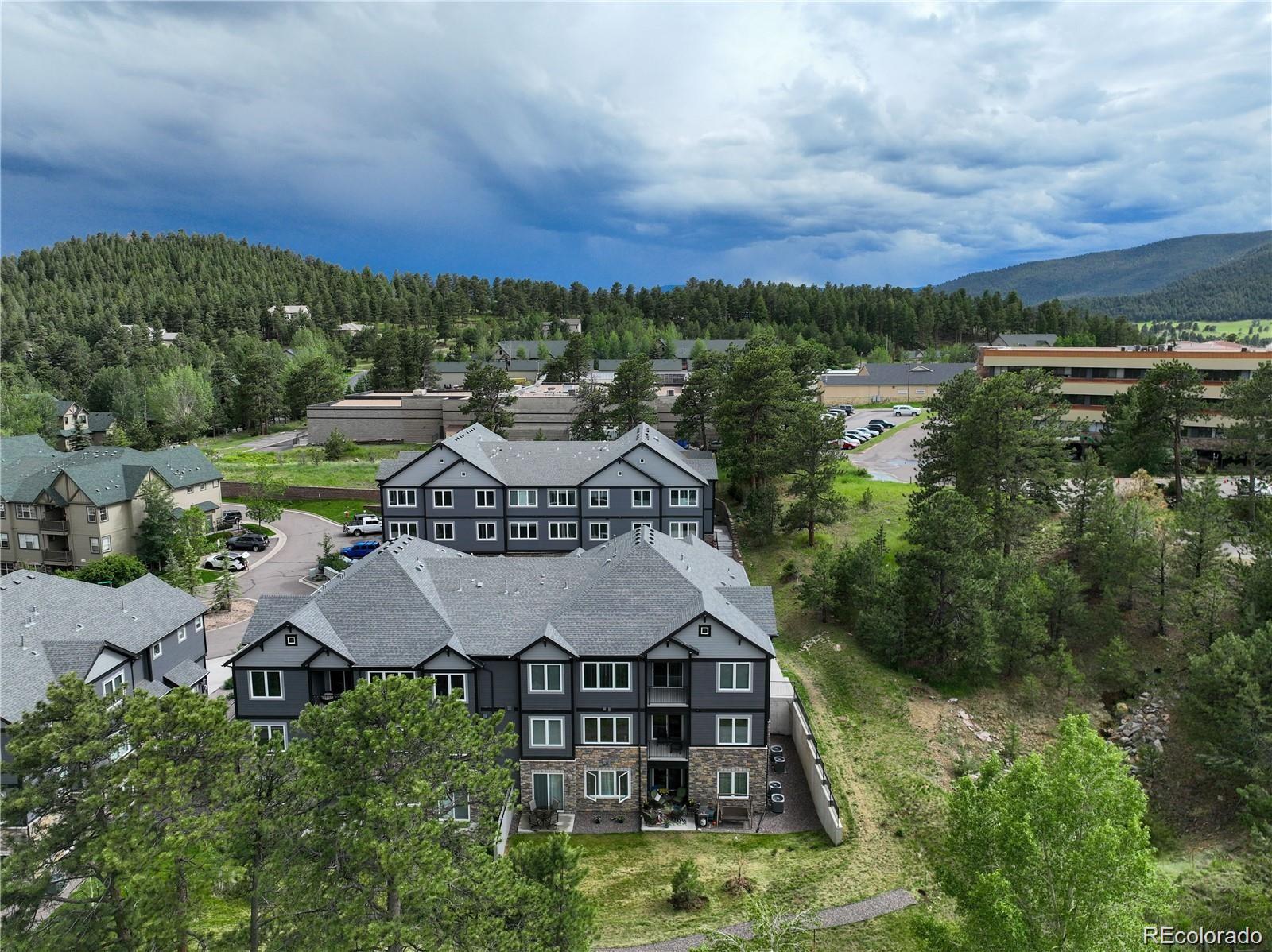 31191 Black Eagle Drive, Unit 301 Evergreen, CO 80439 - Photo 32 of 35 an aerial view of a house with lake view and a city view