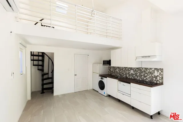 a view of an empty room with closet