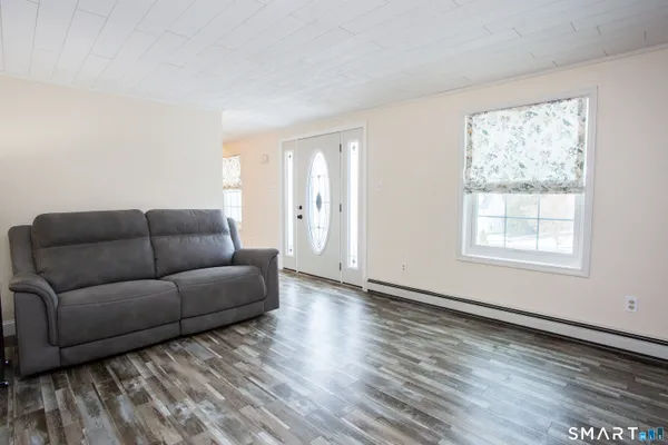 a living room with furniture and a window