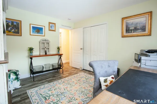a living room with furniture and a rug