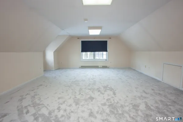 an empty room with a empty space and window