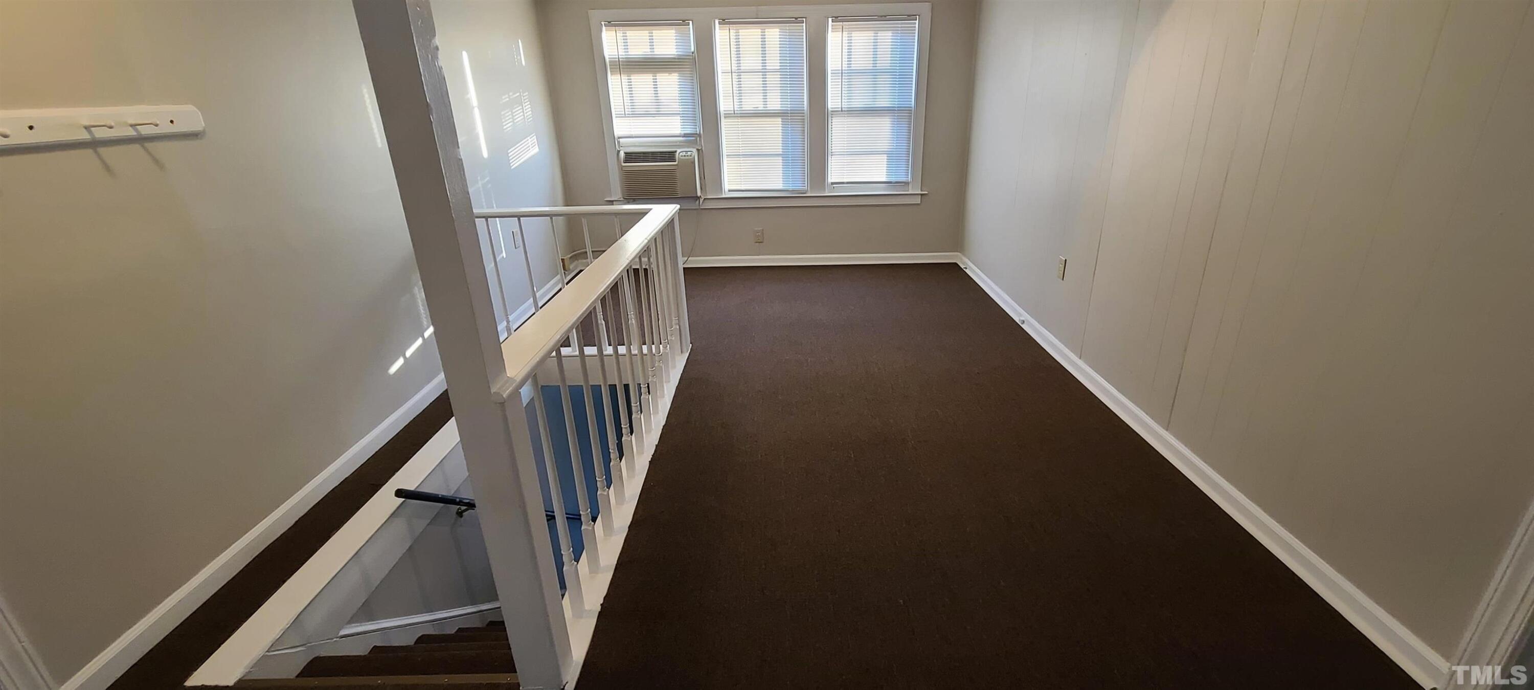 318 Powell Drive, Unit 2 Raleigh, NC 27606 - Photo 3 of 10 a view of entryway and hall with wooden floor