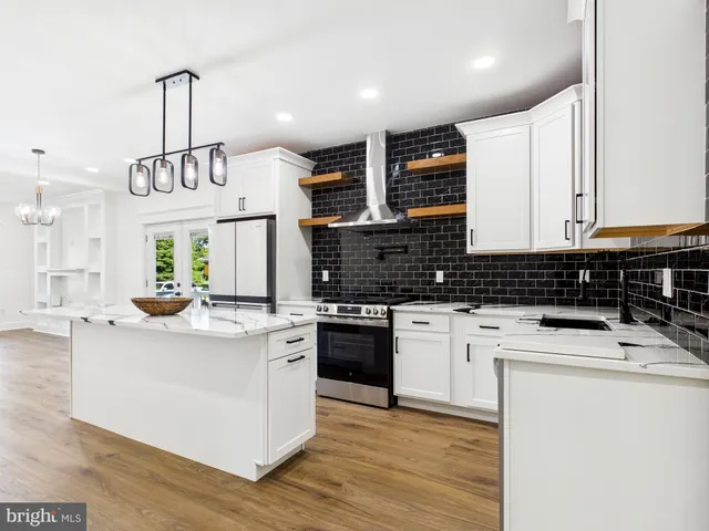 a view of a room with wooden floor