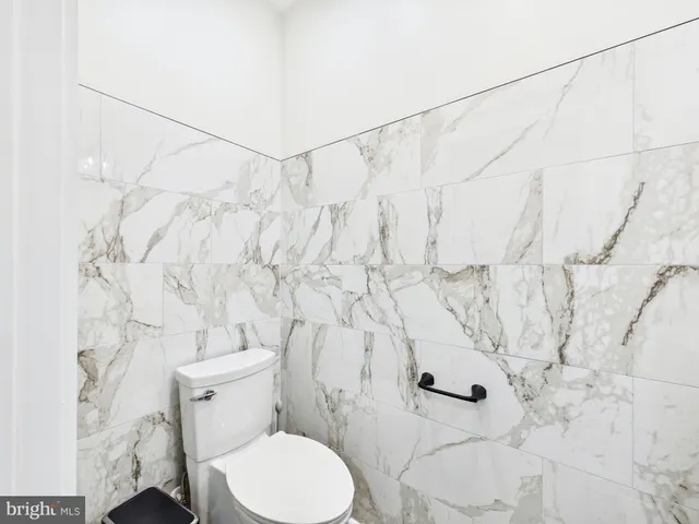 a view of room with window and wooden floor