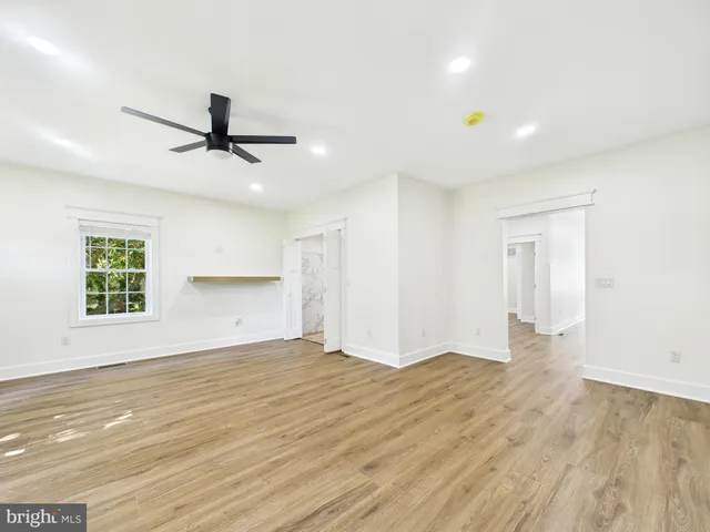 a view of backyard with deck and a garden