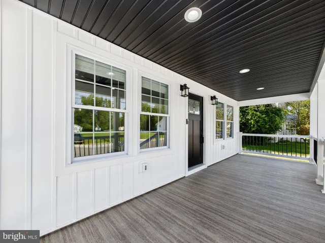a kitchen with granite countertop a sink a stove and cabinets