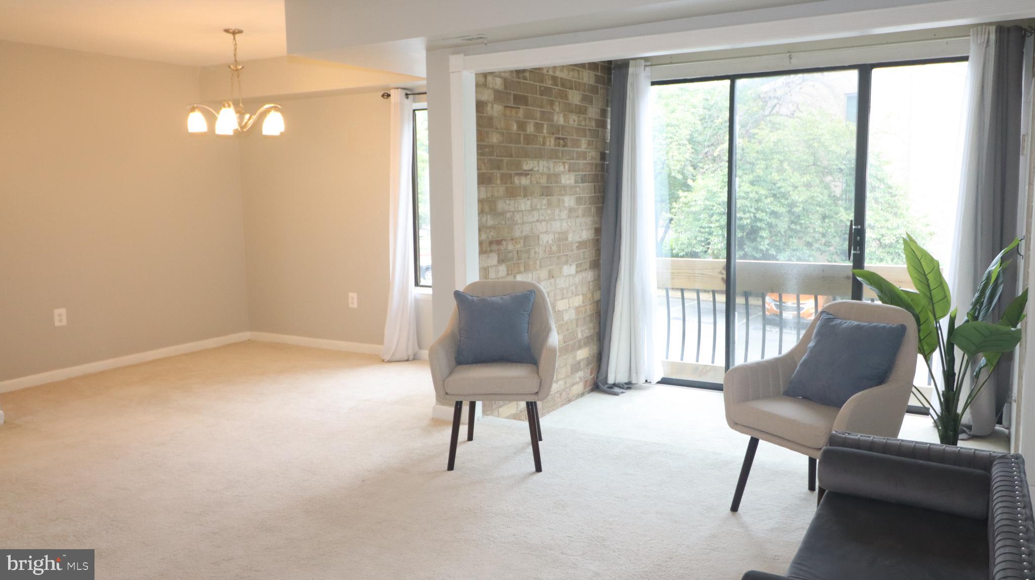 10564 Twin Rivers Road, Unit D1 Columbia, MD 21044 - Photo 3 of 10 Living area + dining area
and nook in the back