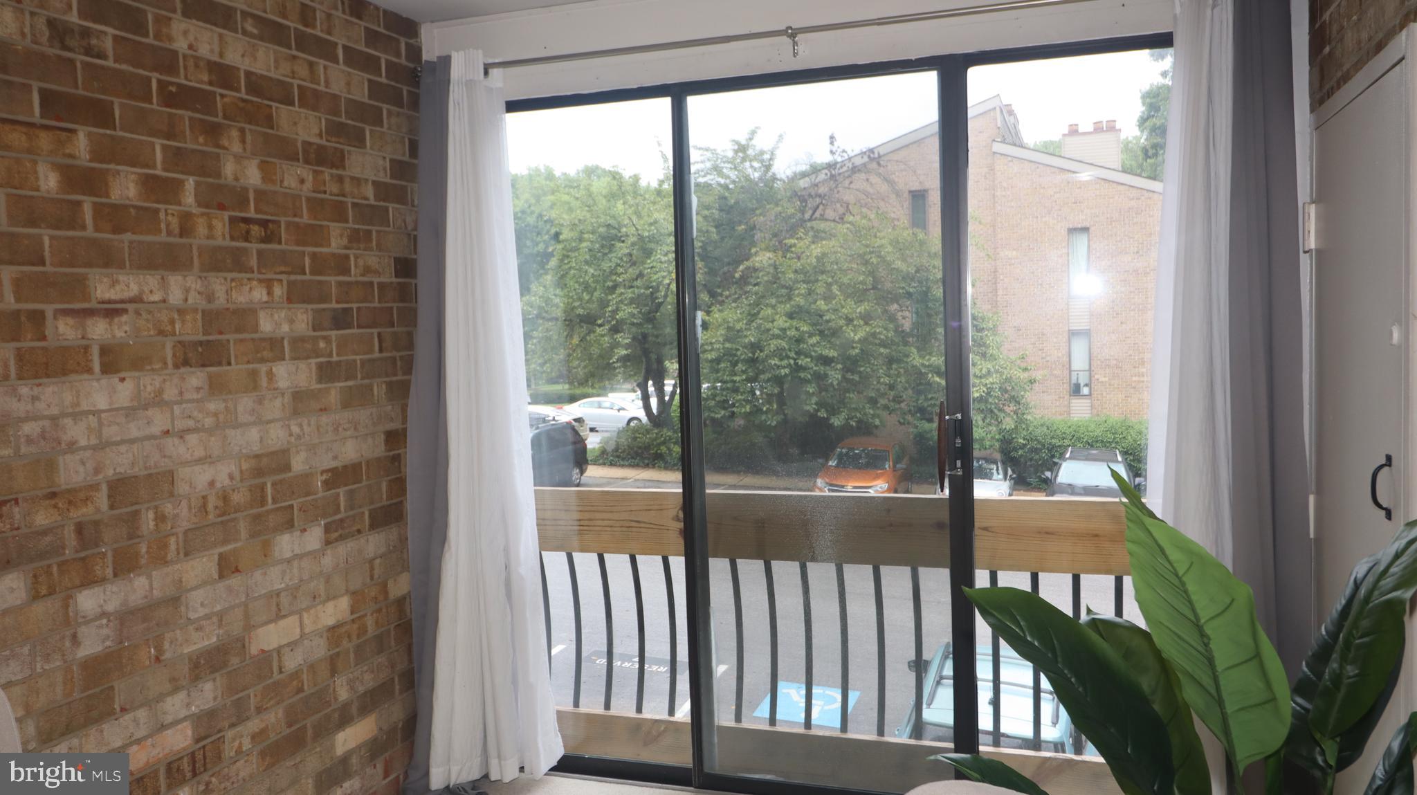 10564 Twin Rivers Road, Unit D1 Columbia, MD 21044 - Photo 9 of 10 Cozy nook with brick accent walls
