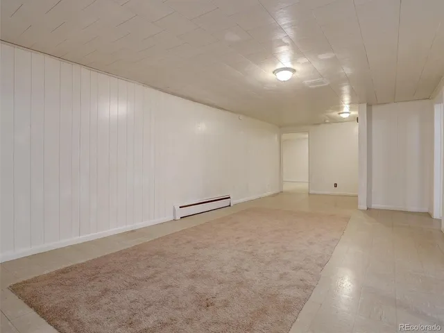a view of storage and utility room with closet