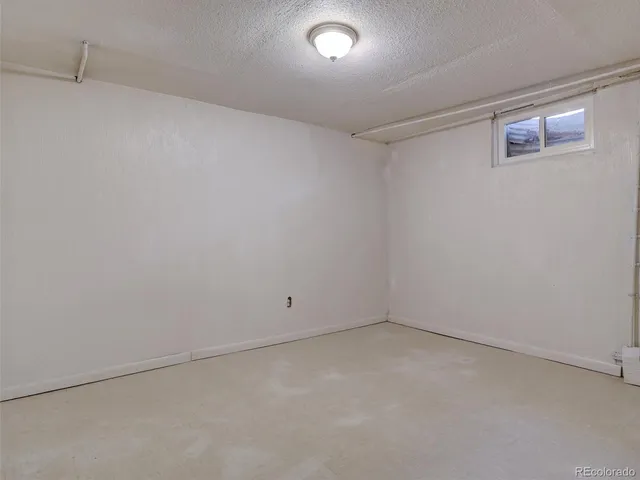 a view of yard with seating space and trampoline