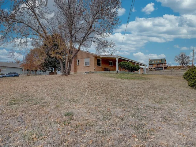an aerial view of a house with a lake view