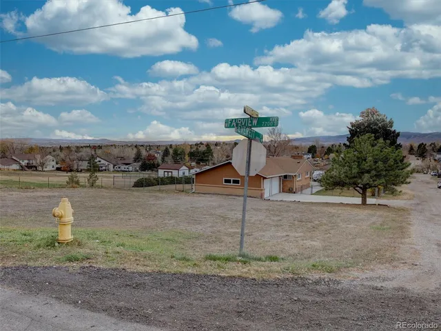 a view of a lake with a yard