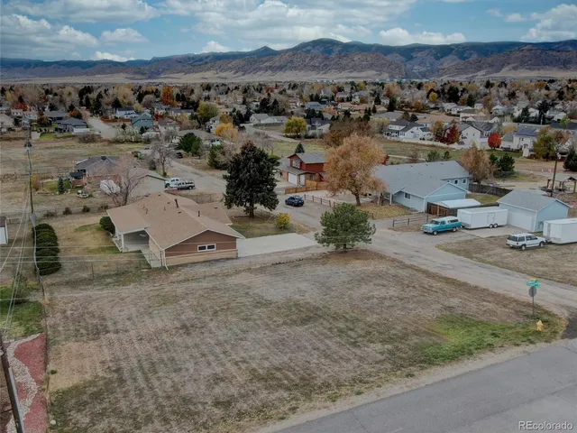 an aerial view of a yard with horses