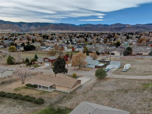 an aerial view of a house with outdoor space