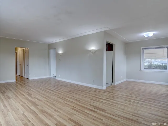 a kitchen with stainless steel appliances granite countertop a sink and a stove