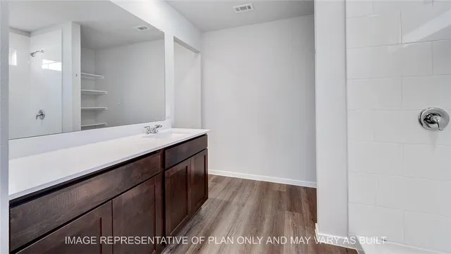 a bathroom with a sink and mirror