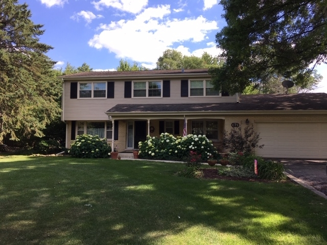 22W679 Poplar Road Glen Ellyn, IL 60137 - Photo 2 of 23 a front view of house with yard and green space