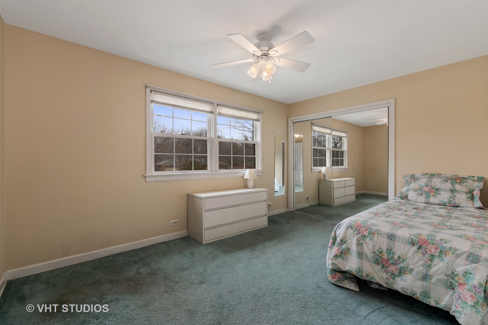 22W679 Poplar Road Glen Ellyn, IL 60137 - Photo 17 of 23 a spacious bedroom with a bed and a chandelier