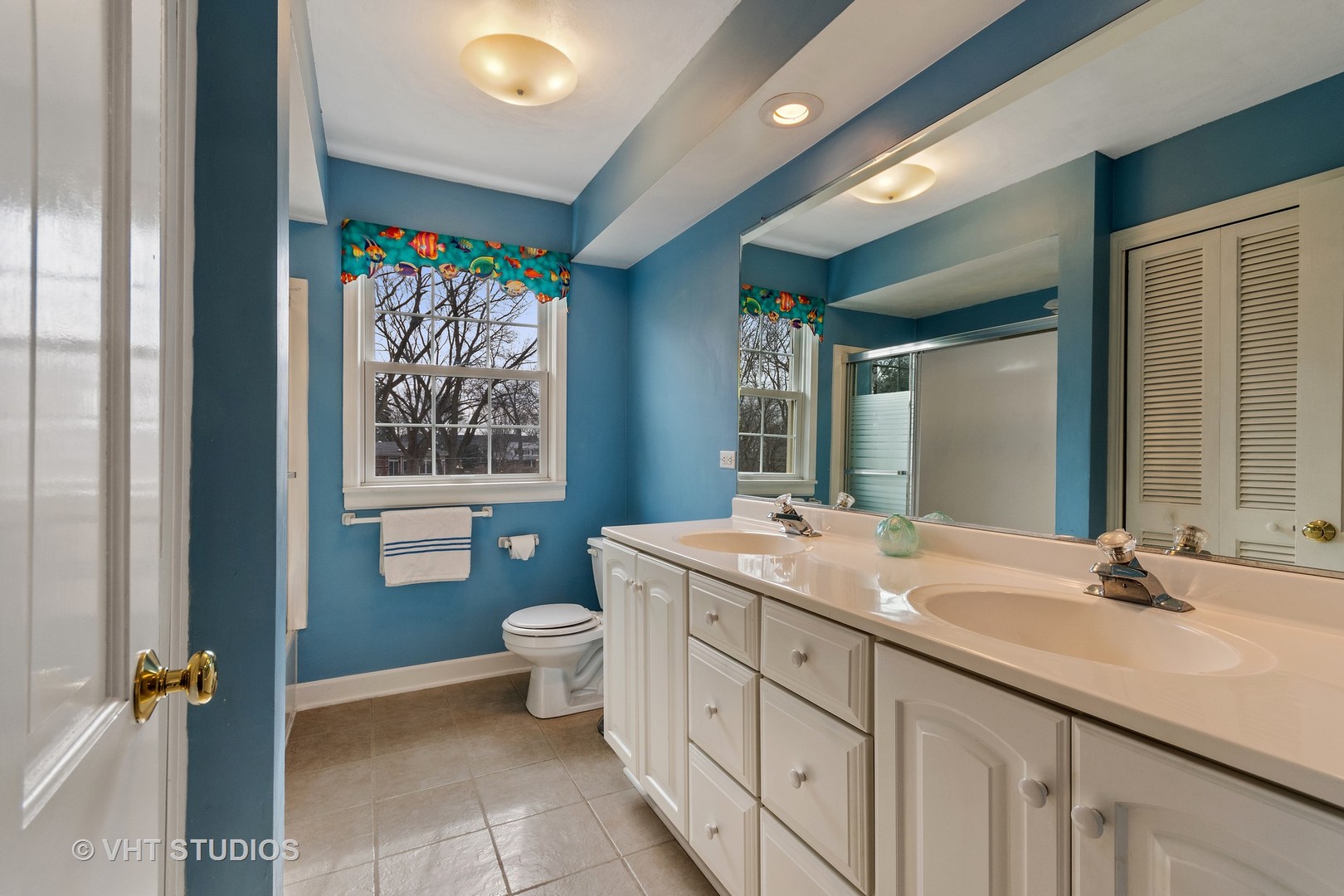 22W679 Poplar Road Glen Ellyn, IL 60137 - Photo 18 of 23 a bathroom with a granite countertop sink mirror vanity and a toilet