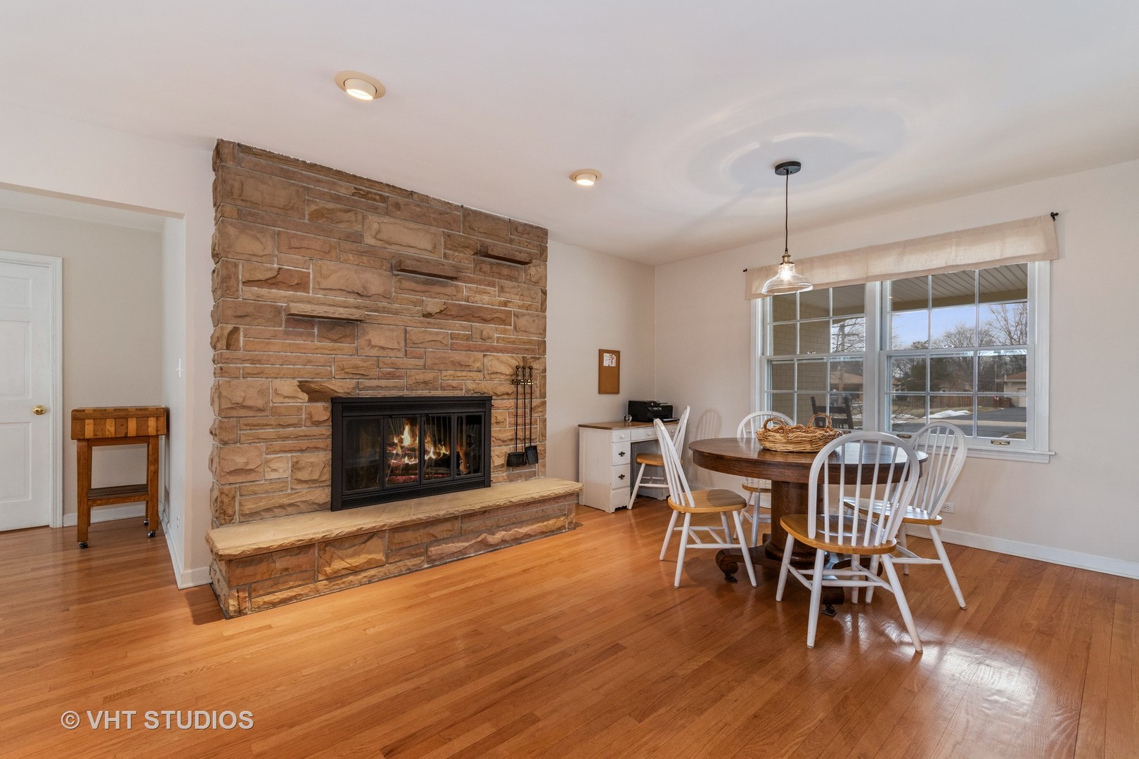 22W679 Poplar Road Glen Ellyn, IL 60137 - Photo 5 of 23 a view of a dining room with furniture window and wooden floor