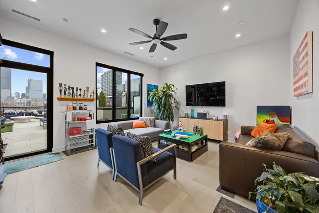 a living room with fireplace furniture and a flat screen tv