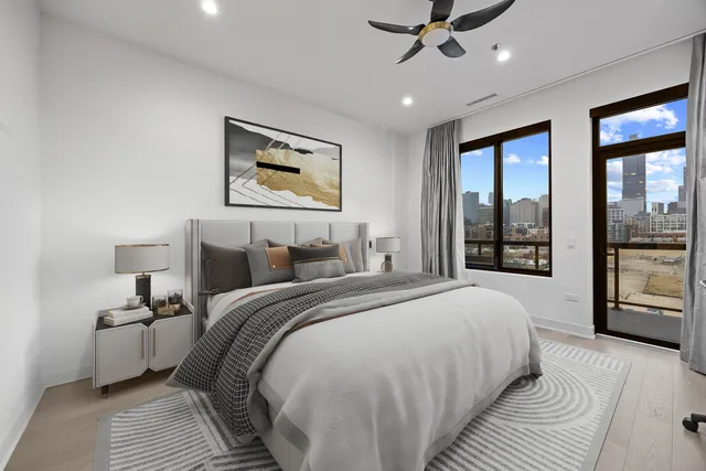 a bedroom with a large bed and a window